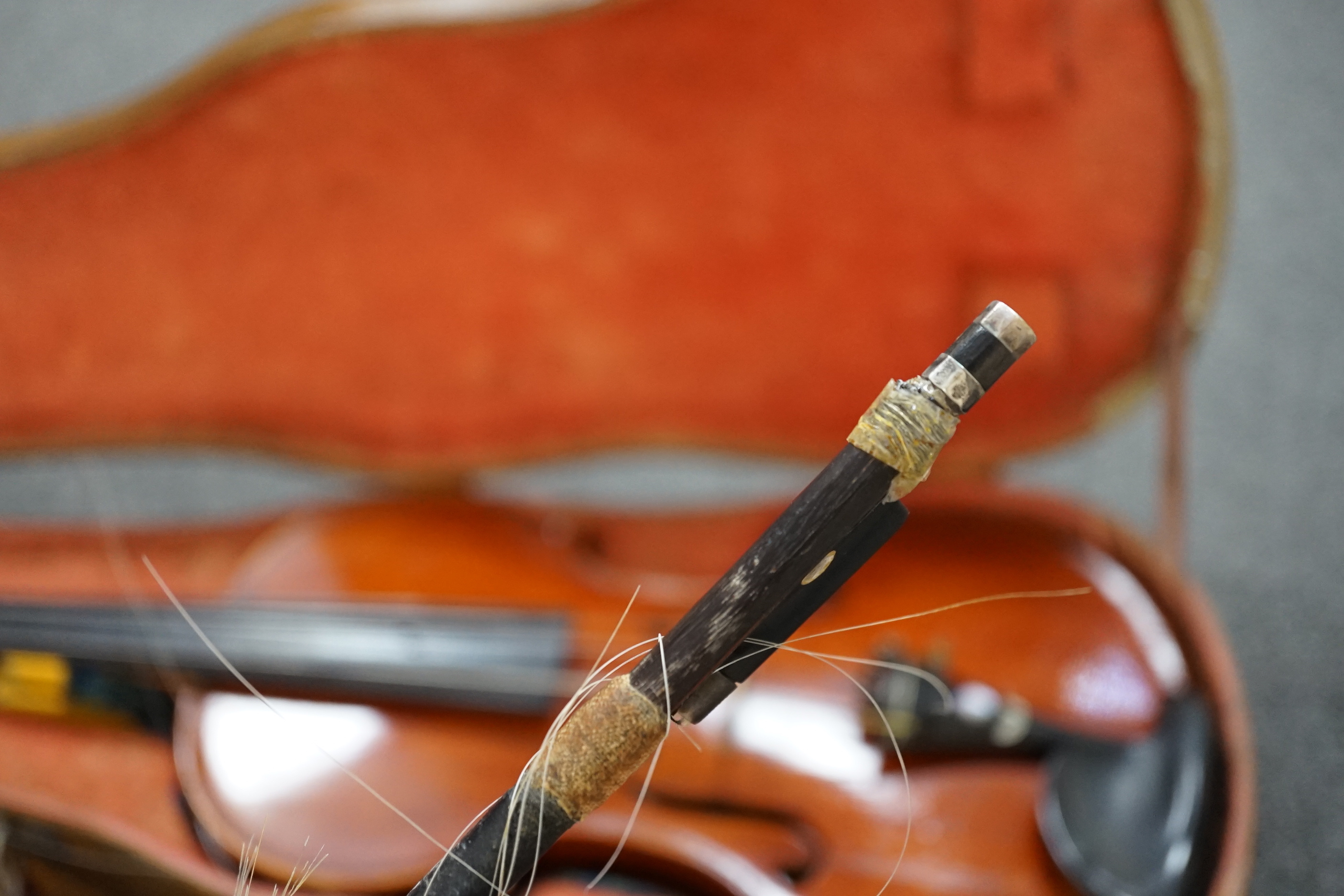 A 19th century violin with silver mounted bow and case, back measures 36cm CITES Submission reference JX7RJU7S